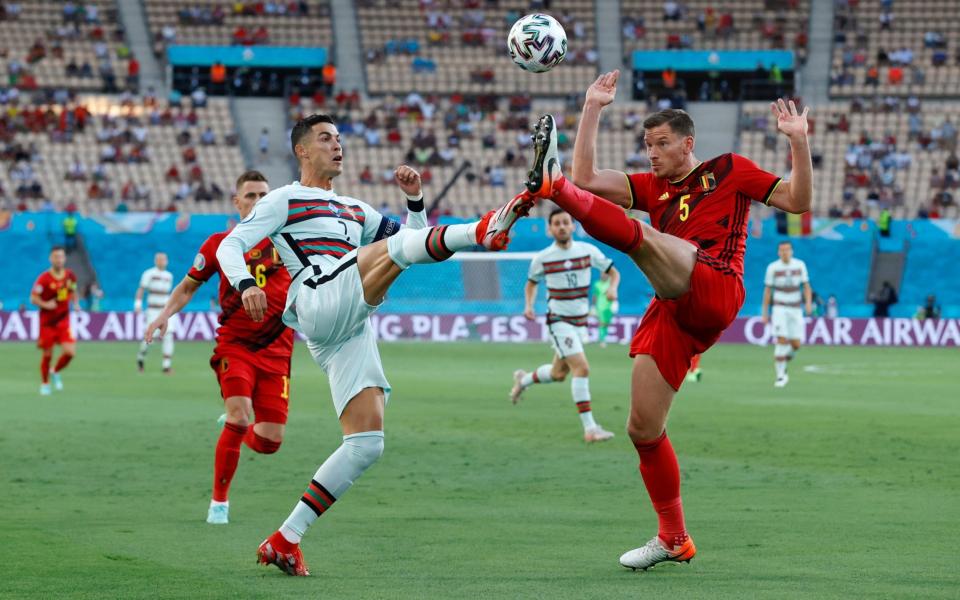 Cristiano Ronaldo of Portugal battles for possession with Jan Vertonghen of Belgium during the UEFA Euro 2020 Championship Round of 16  - Marcelo Del Pozo - Pool/Getty Images