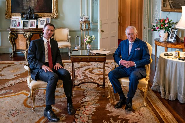 <p>AARON CHOWN/POOL/AFP via Getty </p> King Charles and Hunt pictured in the private audience room at Buckingham Palace on Tuesday