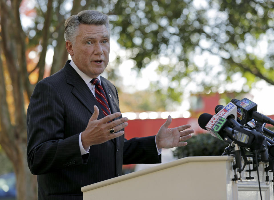 FILE - In this Nov. 7, 2018 file photo Republican Mark Harris speaks to the media during a news conference in Matthews, N.C. The North Carolina board investigating allegations of ballot fraud in a still-unresolved congressional race between Harris and Democrat Dan McCready could be disbanded Friday, Dec. 28 under a state court ruling in a protracted legal battle about how the panel operates. The state Elections Board has refused to certify the race between Harris and McCready while it investigates absentee ballot irregularities in the congressional district stretching from the Charlotte area through several counties to the east. Harris holds a slim lead in unofficial results, but election officials are looking into criminal allegations against an operative hired by the Harris campaign. (AP Photo/Chuck Burton, File)