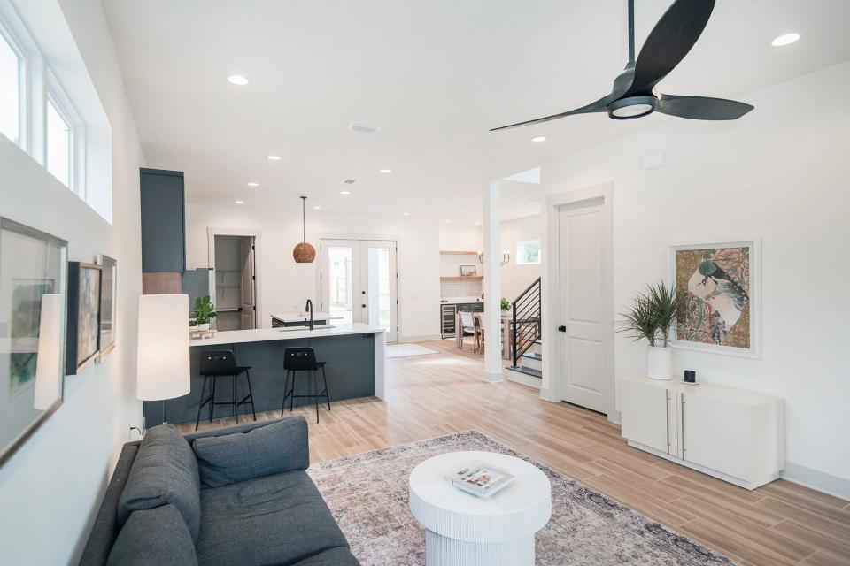 The living area flows seamlessly into the kitchen and dining space.