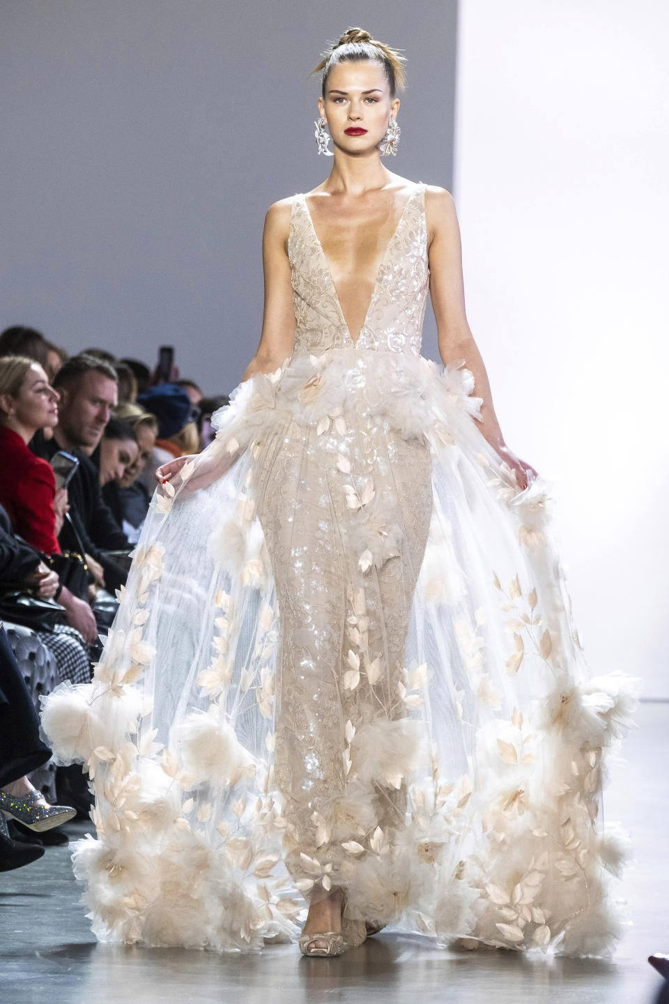 The Badgley Mischka collection is modeled at Spring Studios during NYFW Fall/Winter 2020 on Saturday, Feb. 8, 2020, in New York. (Photo by Charles Sykes/Invision/AP)