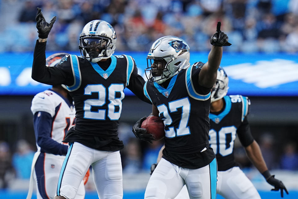 Carolina Panthers cornerback T.J. Carrie (27) celebrates after recovering a fumble by Denver Broncos wide receiver Jalen Virgil during the second half of an NFL football game between the Carolina Panthers and the Denver Broncos on Sunday, Nov. 27, 2022, in Charlotte, N.C.(AP Photo/Rusty Jones)