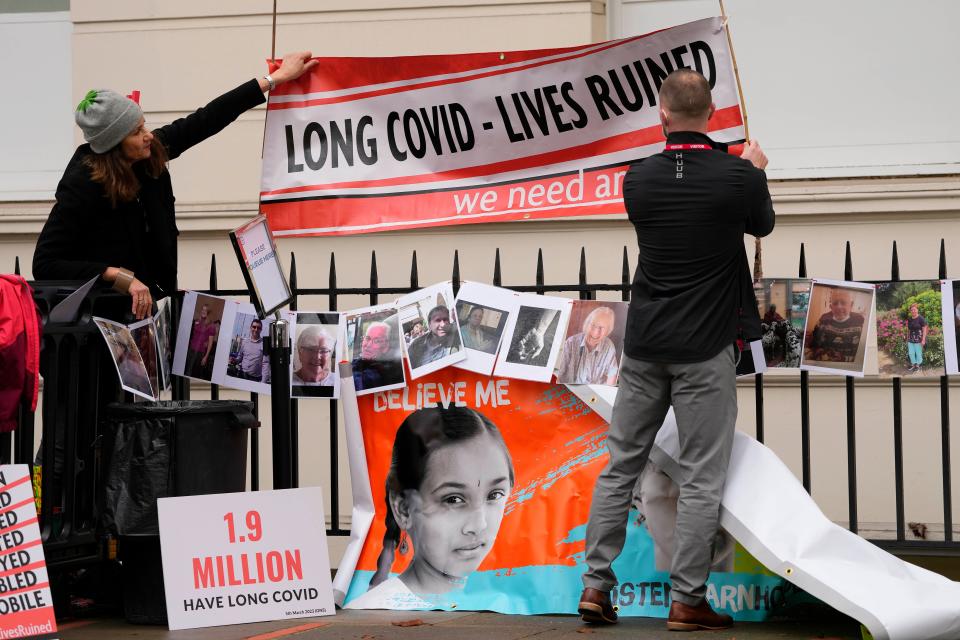 Protesters fix a banner outside Dorland House as Britain's former Prime Minister Boris Johnson testified (Copyright 2023 The Associated Press. All rights reserved)