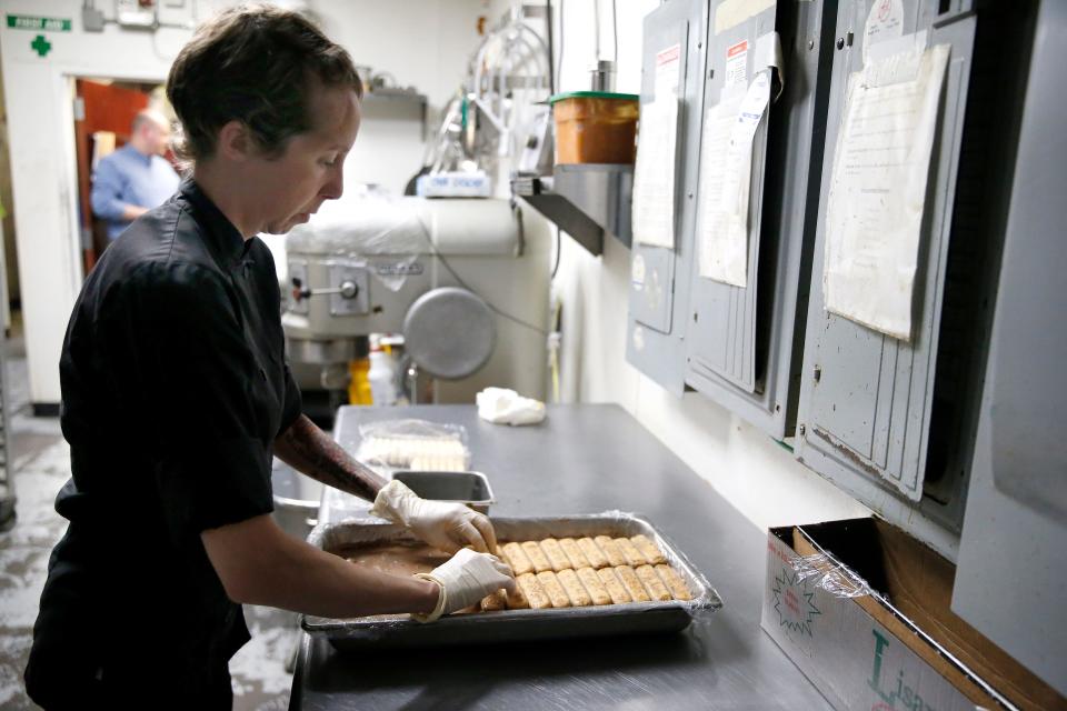 Chef Rachel Foster works in the kitchen Thursday at Moni's Pasta and Pizza.