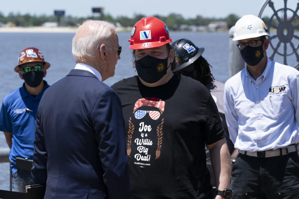 President Joe Biden greets people after speaking with the Interstate 10 Calcasieu River Bridge behind him, Thursday, May 6, 2021, in Lake Charles, La. (AP Photo/Alex Brandon)