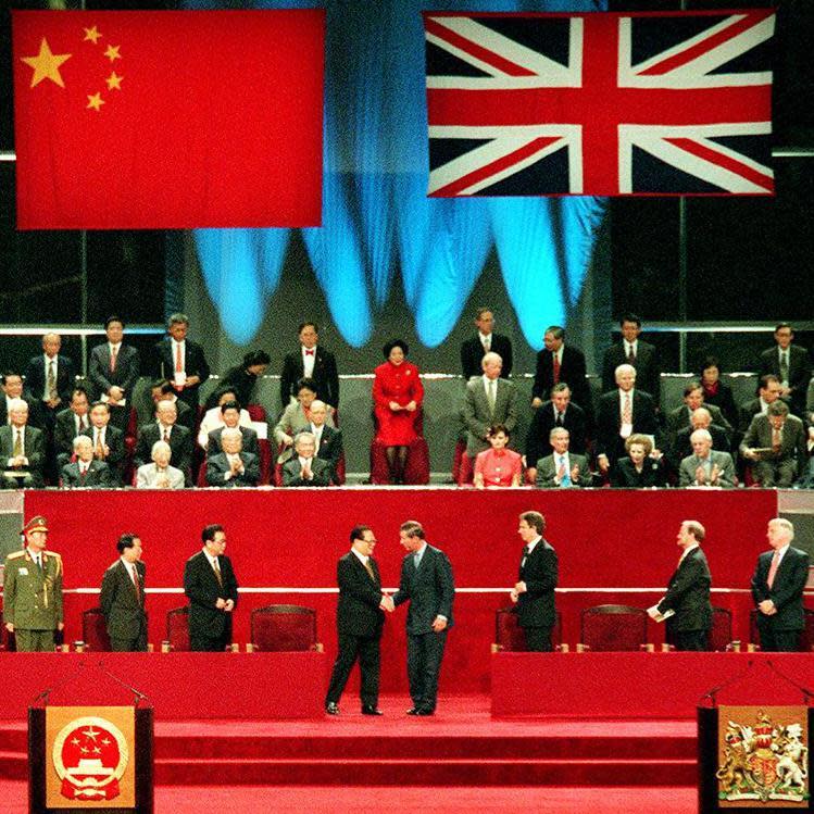 Chinese president Jiang Zemin shakes hand with Charles, Prince of Wales at the Hong Kong handover ceremony at HK Convention and Exhibition Centre, to mark Hong Kong's return to Chinese sovereignty at midnight, 30 June 1997.