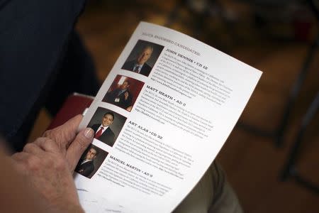 A flyer listing endorsed candidates is distributed at a meeting of so-called "Liberty Kids" libertarian Republican activists in Burbank, California, July 27, 2014. REUTERS/David McNew