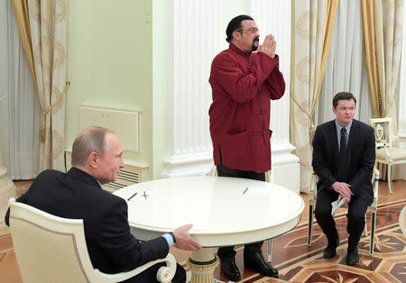 Russia's President Vladimir Putin (L) meets with U.S. actor Steven Seagal (C) at the Kremlin in Moscow, Russia, November 25, 2016. Sputnik/Kremlin/Alexei Druzhinin via REUTERS