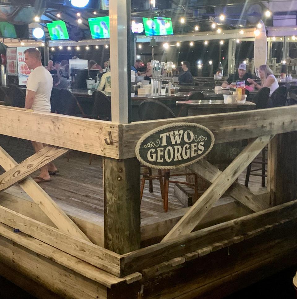 Patrons dine at Two Georges waterfront restaurant in Boynton Beach the day after Hurricane Nicole.