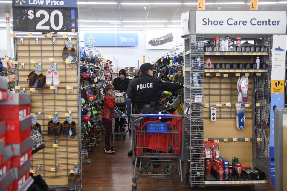 Police officers shop with kids during the Columbia County SheriffÕs Office Day with a Deputy at Walmart on Thursday, Dec. 21, 2023.