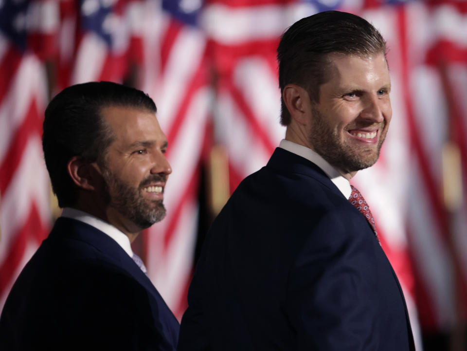 Donald Trump Jr. and Eric Trump look on as their father, President Donald Trump, prepares to deliver his acceptance speech for the Republican presidential nomination. (Photo: Alex Wong via Getty Images)