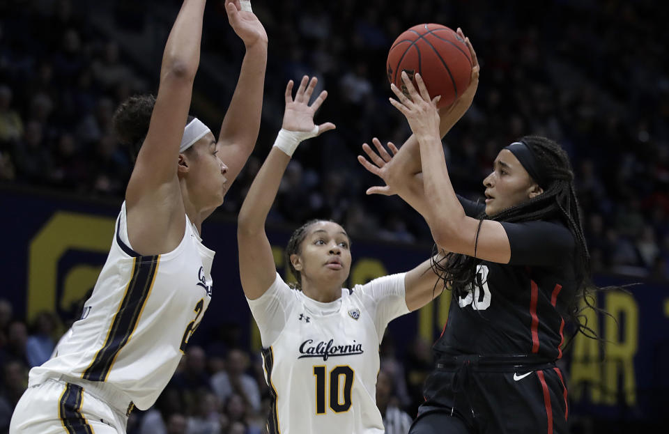 Stanford's Haley Jones, right, looks to pass away from California's Evelien Lutje Schipholt, left, and Jazlen Green (10) in the first half of an NCAA college basketball game Sunday, Jan. 12, 2020, in Berkeley, Calif. (AP Photo/Ben Margot)