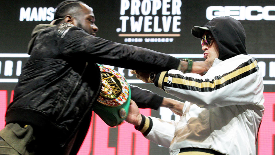 Deontay Wilder and Tyson Fury, pictured here shoving each other at their press conference.