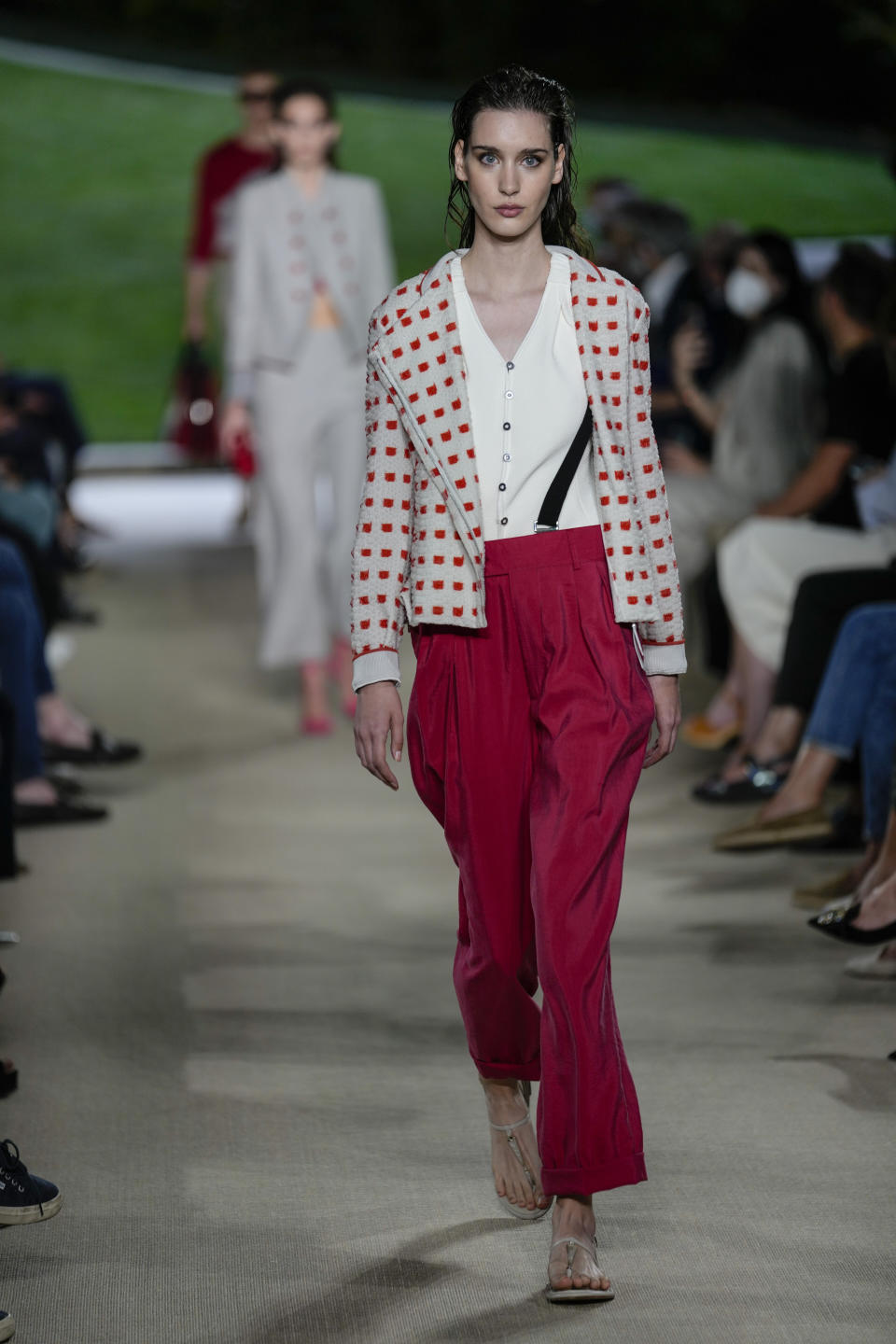 A model wears a creation as part of the Giorgio Armani Spring Summer 2022 collection, in Milan, Italy, Monday, June 21, 2021. (AP Photo/Luca Bruno)