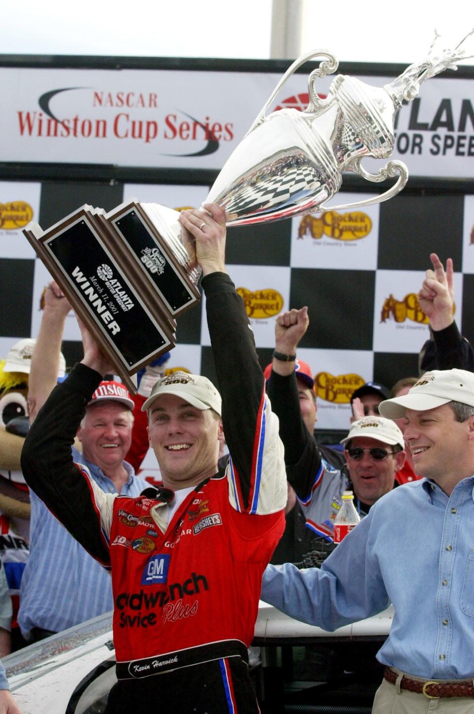 The first of many: Kevin Harvick hoists the trophy from Atlanta's Victory Lane in 2001.