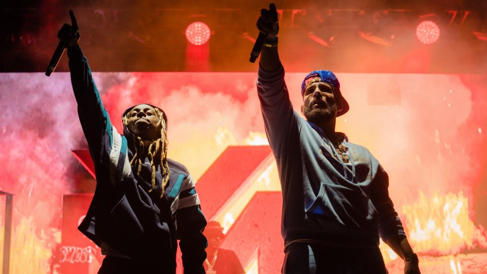 Lil Wayne and DJ Drama perform during their Gangsta Grillz set at Dreamville Festival. - Credit: Greg Noire