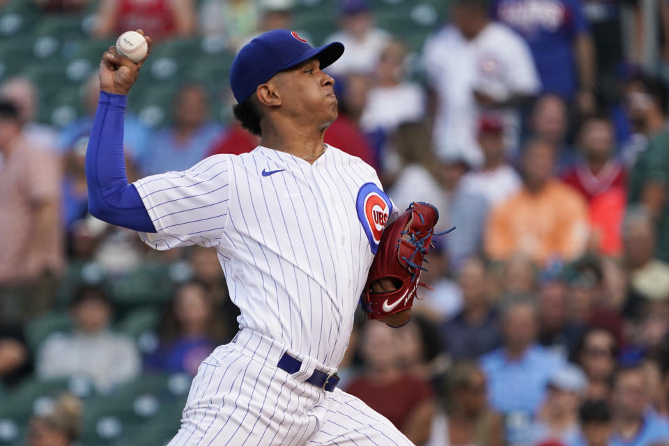 Chicago Cubs starting pitcher Adbert Alzolay throws to a Cincinnati Reds batter during the first inning of a baseball game, Tuesday, July 27, 2021, in Chicago. (AP Photo/David Banks)