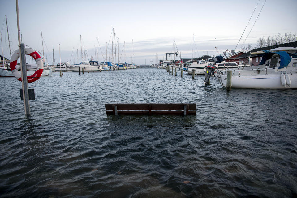 High water is seen during a storm in Juelsminde Harbor, Jutland, Denmark, Friday Dec. 22, 2023. High tides and flooding is caused by the storm Pia which hit Denmark on Thursday and the night of Friday. (Morten Pape/Ritzau Scanpix via AP)