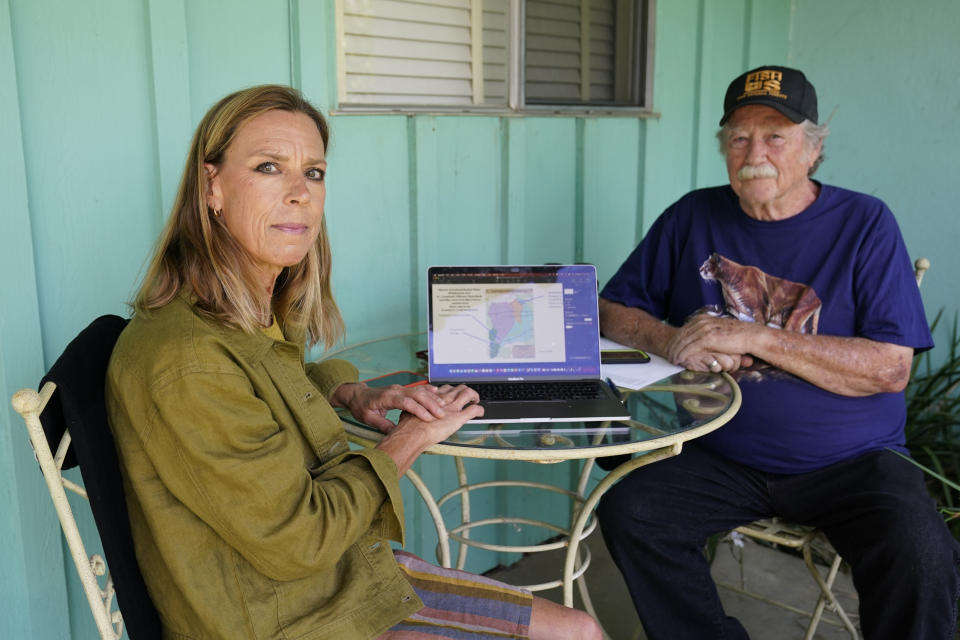 Amanda Frye, left, and Steve Loe, a retired U.S. Forest Service biologist, pose for a portrait on Friday, Sept. 15, 2023, in Redlands, Calif. The two have led efforts to stop BlueTriton, the company that produces the widely-known Arrowhead brand of bottled water, from drawing water from certain points in the San Bernardino National Forest. The State Water Resources Control Board is expected to vote Tuesday on whether to issue a cease-and-desist order against BlueTriton. (AP Photo/Ashley Landis)