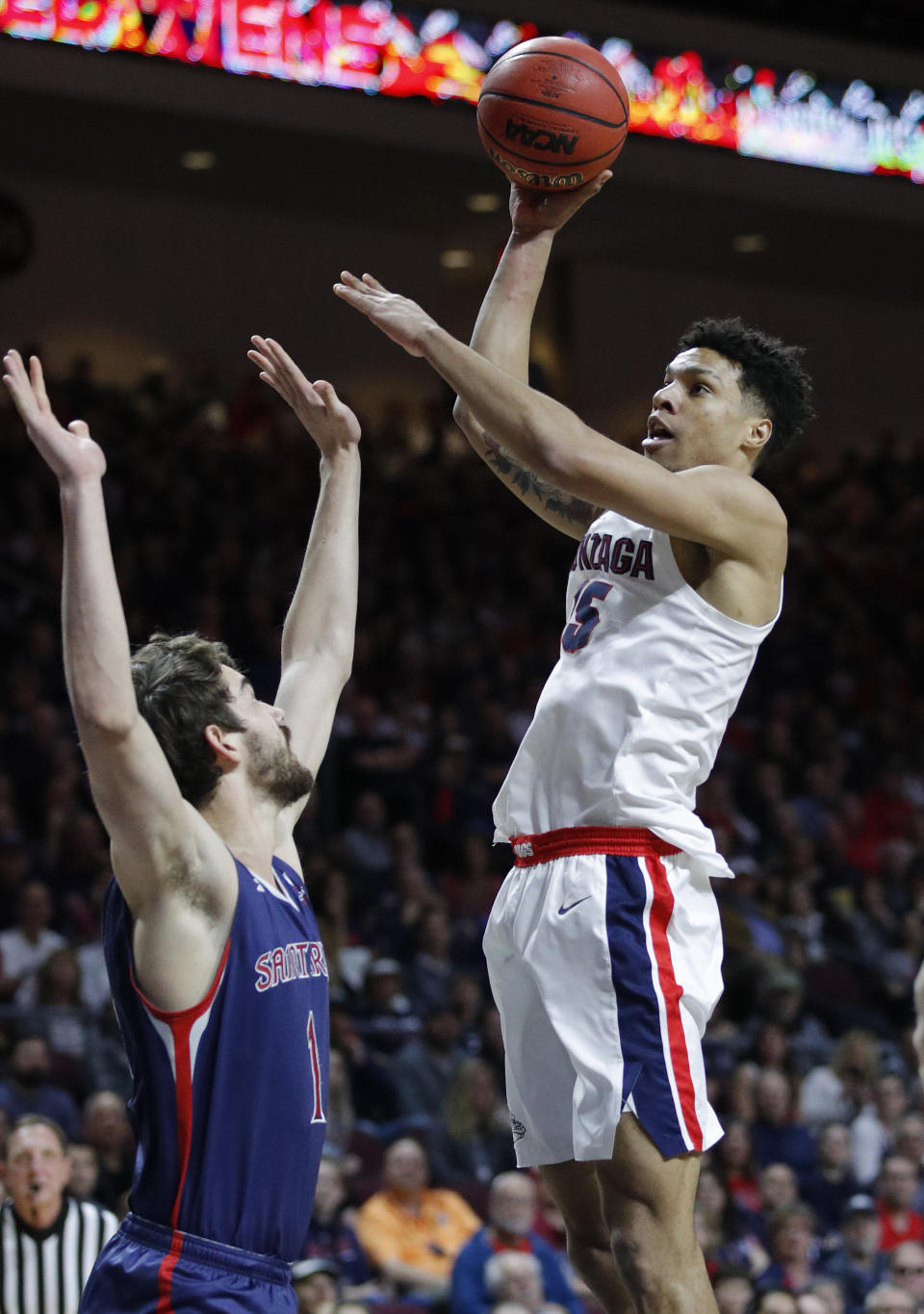 Gonzaga's Brandon Clarke shoots over St. Mary's Jordan Hunter during the first half of an NCAA college basketball game for the West Coast Conference men's tournament title, Tuesday, March 12, 2019, in Las Vegas. (AP Photo/John Locher)