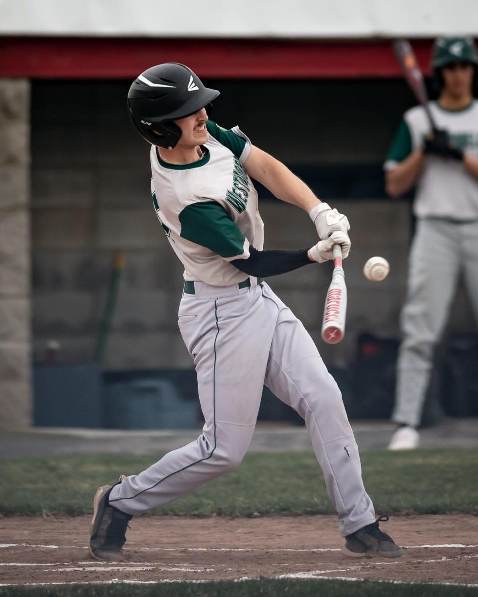 Westmoreland's Owen Davison swings at a pitch against Oriskany Saturday at DeLutis Field in Rome.