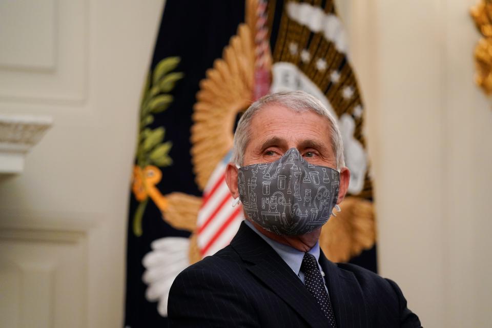 Dr. Anthony Fauci, director of the National Institute of Allergy and Infectious Diseases, listens during an event with President Joe Biden on the coronavirus in the State Dinning Room of the White House, Thursday, Jan. 21, 2021.