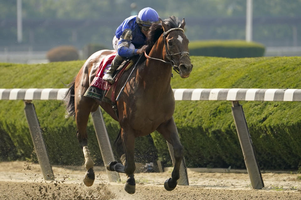 Cody's Wish, with jockey Junior Alvarado, runs down the final stretch to win The Hill N' Dale Metropolitan horse race ahead of the Belmont Stakes horse race, Saturday, June 10, 2023, at Belmont Park in Elmont, N.Y. (AP Photo/John Minchillo)