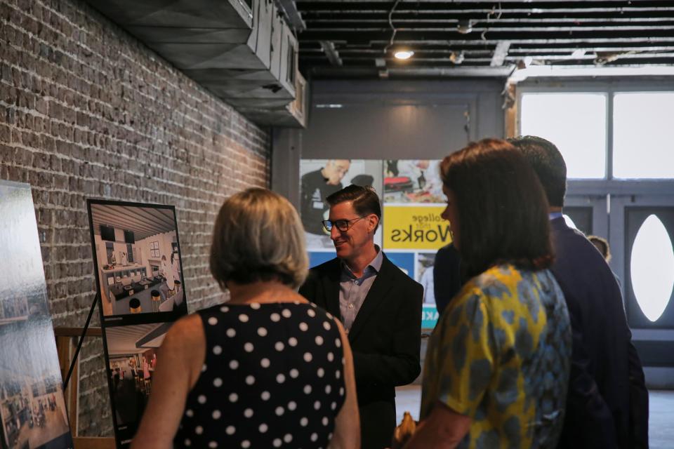 Visitors mingle at the Savannah Culinary Institute meeting on Thursday, June 2, 2022. The meeting was held to talk about the proposed layout of the new building on West Bay Street in downtown Savannah.