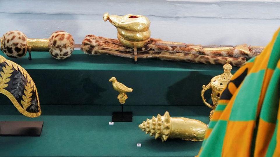 A man looking at the objects on display at the Manhyia Palace Museum