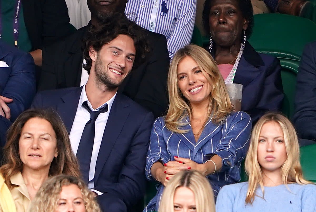 Sienna Miller with boyfriend Oli Green at Wimbledon earlier this year  (PA)