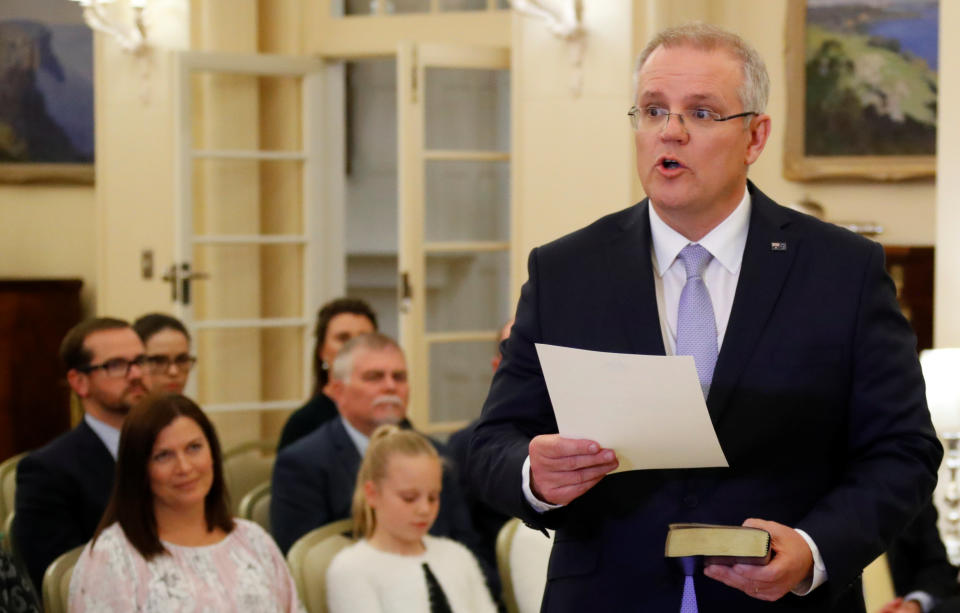 The new Australian Prime Minister Scott Morrison attends a swearing-in ceremony as his wife Jenny looks on, in Canberra. Source: Reuters