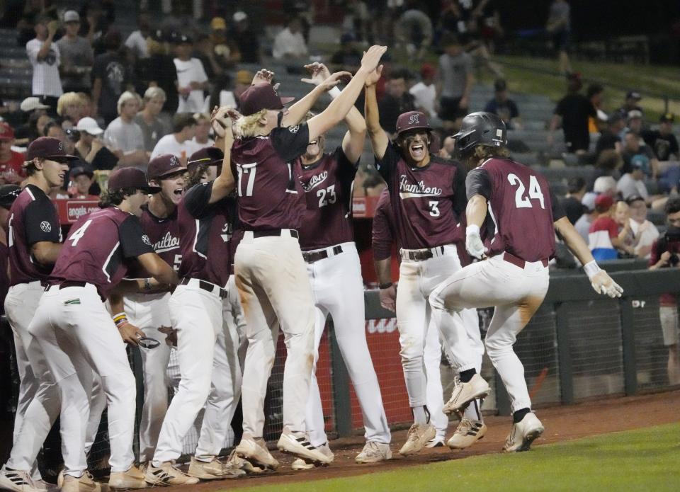 May 17, 2022; Tempe, Arizona, USA; Hamilton's Gavin Turley (24) is congratulated after a home run against Chandler during the 6A baseball final at Tempe Diablo Stadium. Mandatory Credit: Michael Chow-Arizona Republic