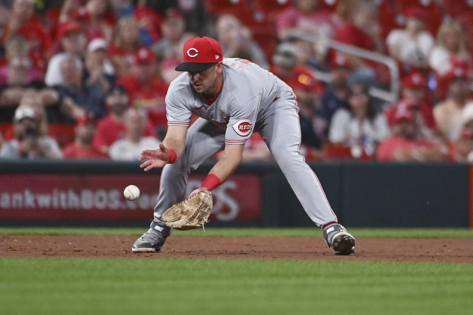 Cincinnati Reds first baseman Spencer Steer fields a ground ball hit by St. Louis Cardinals' Yadier Molina, who was out at first during the third inning of a baseball game Thursday, Sept. 15, 2022, in St. Louis. (AP Photo/Joe Puetz)