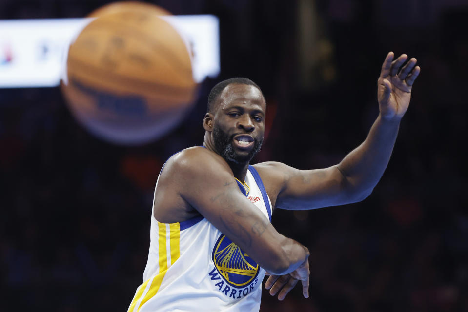 Golden State Warriors forward Draymond Green passes the ball during the second half of the team's NBA in-season tournament basketball game against the Oklahoma City Thunder on Friday, Nov. 3, 2023, in Oklahoma City. (AP Photo/Nate Billings)