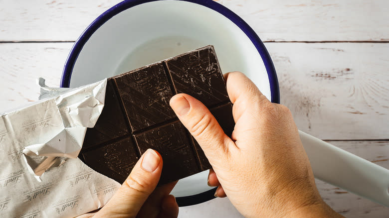 Adding chocolate to saucepan