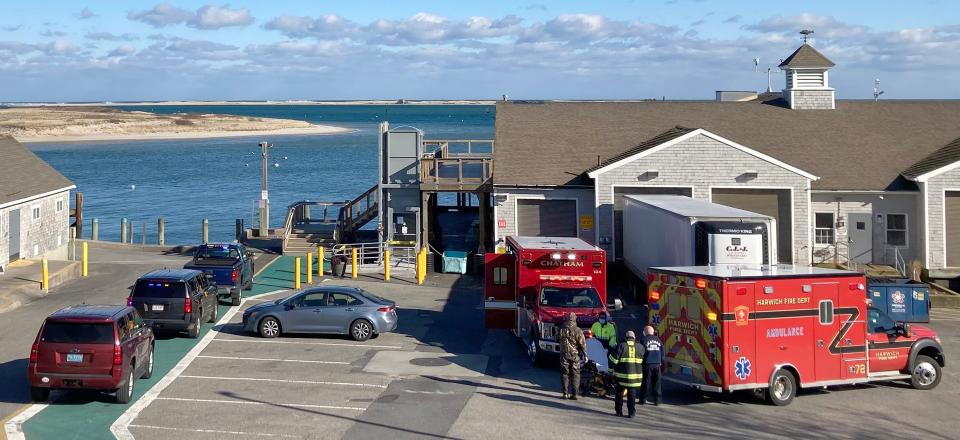 Chatham and Harwich rescue personnel at the Chatham Fish Pier following a call for an overturned boat with four duck hunters and a dog in Chatham Harbor early Tuesday afternoon. None of the rescued hunters required transport to the hospital.