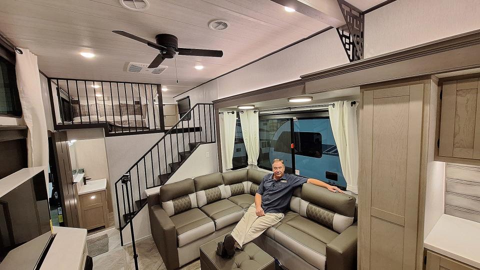 Paul T. Willis, general manager of Best Choice RV in Irwin, relaxes in a destination trailer on display at the 2024 Pittsburgh RV Show at the David L. Lawrence Convention Center.