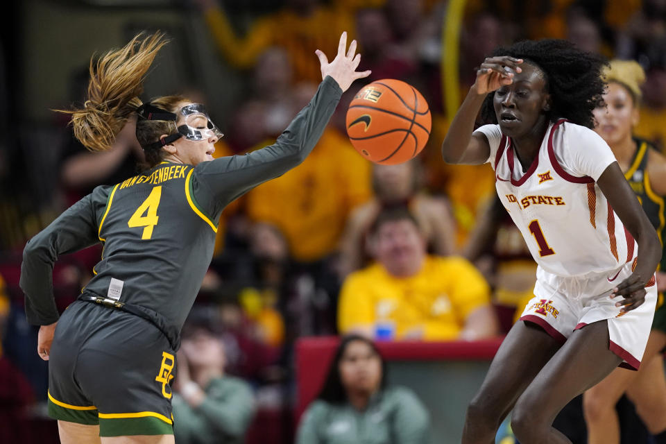 Baylor guard Jana Van Gytenbeek (4) loses control of the ball in front of Iowa State forward Nyamer Diew (1) during the first half of an NCAA college basketball game, Saturday, Feb. 4, 2023, in Ames, Iowa. (AP Photo/Charlie Neibergall)