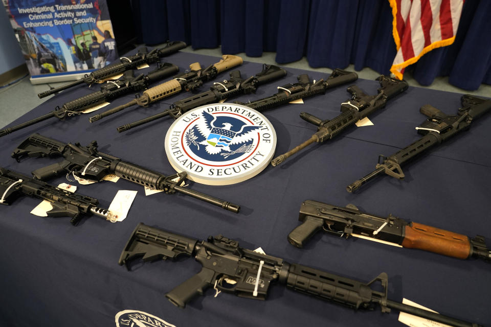 Firearms are displayed during a news conference at the Homeland Security Investigations Miami Field Office (HSI), Wednesday, Aug. 17, 2022, in Miami. HSI is working with other agencies to highlight efforts to crack down on a recent increase of firearms and ammunition smuggling to Haiti and other Caribbean nations. (AP Photo/Lynne Sladky)