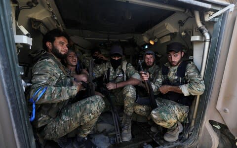 The Syrian rebels take arms and directions from Turkey - Credit: REUTERS/Khalil Ashawi