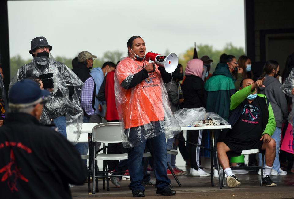 NDN Collective president and CEO Nick Tilsen speaks into a megaphone before a demonstration through the streets of Pierre after the final draft of the state's proposed social studies standards left out multiple specific references to the Oceti Sakowin on Monday, September 13, 2021.