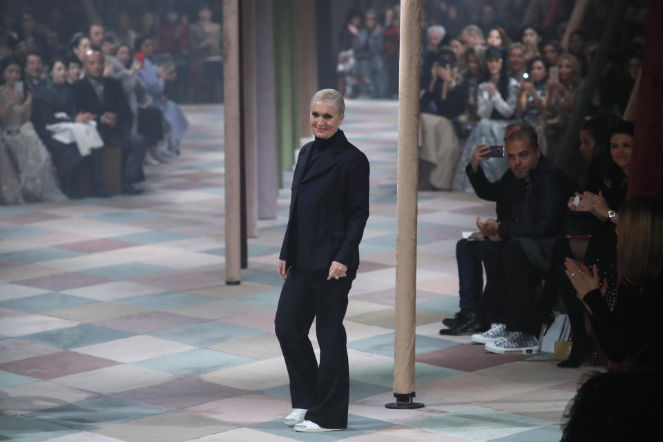 Designer Maria Grazia Chiuri accepts applause at the end of the Dior Spring/Summer 2019 Haute Couture fashion collection presented in Paris, Monday Jan. 21, 2019. (AP Photo/Francois Mori)