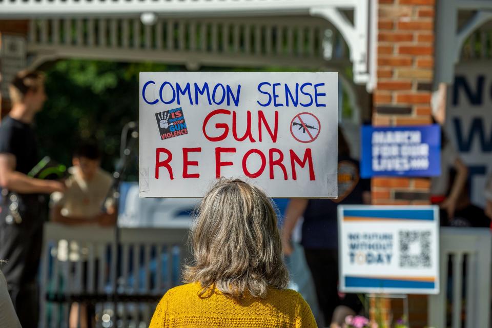 People fill Centennial Park in Oxford to listen to speakers before they marched to Oxford High School and back for the March For Our Lives Oxford event on Saturday, June 11, 2022. Students, teachers and parents shared their stories of loss following the shooting at the school and demanded that lawmakers enact gun control laws to keep these tragedies from happening again.