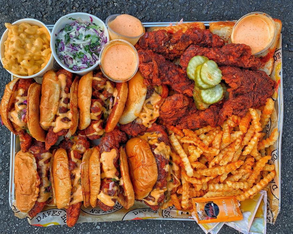 Usher is the newest big-name performer to invest in Dave's Hot Chicken. Seen here are the restaurant's tenders, sliders, fries and sides.