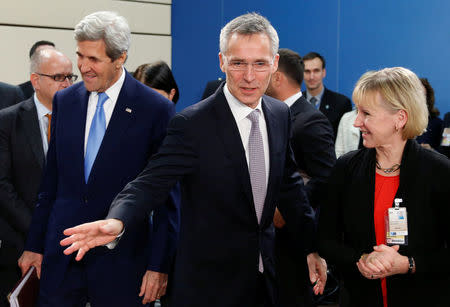 NATO Secretary-General Jens Stoltenberg gestures next to U.S. Secretary of State John Kerry (L) and Swedish Foreign Minister Margot Wallstrom (R) during a NATO foreign ministers meeting at the Alliance headquarters in Brussels, Belgium, December 6, 2016. REUTERS/Francois Lenoir