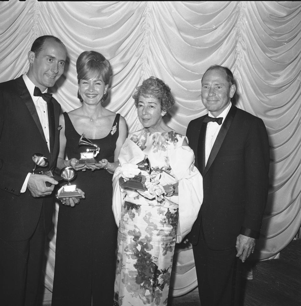 Left to right: Henry Mancini, his wife Ginny, Ginger Mercer, and her husband song writer Johnny Mercer, are shown at the Grammy Awards in Hollywood, May 13, 1964.  Mancini's "Days of Wine and Roses" got Grammys for record of the year and best background arrangement, which Mercer composed. 