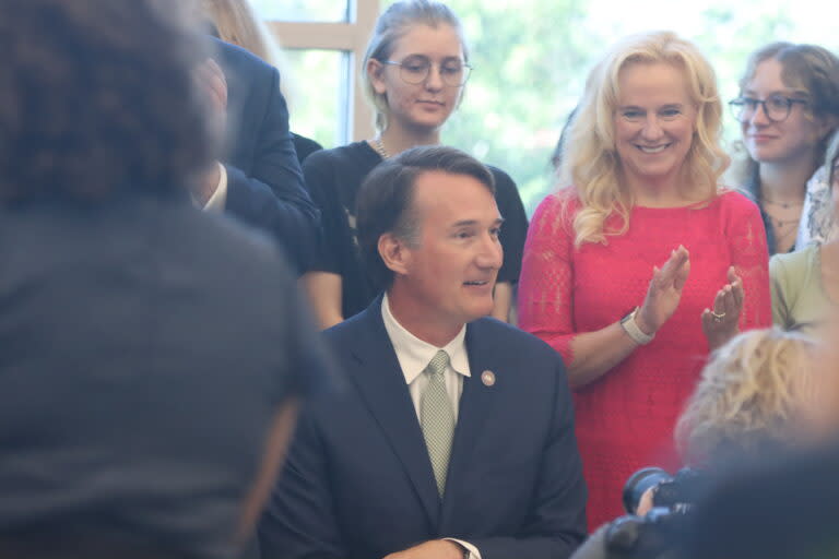 Governor Glenn Youngkin in front of cameras at Colonial Forge High School on Sept. 1, 2022. At right is Virginia Superintendent of Public Instruction Jillian Balow. (Nathaniel Cline/Virginia Mercury)