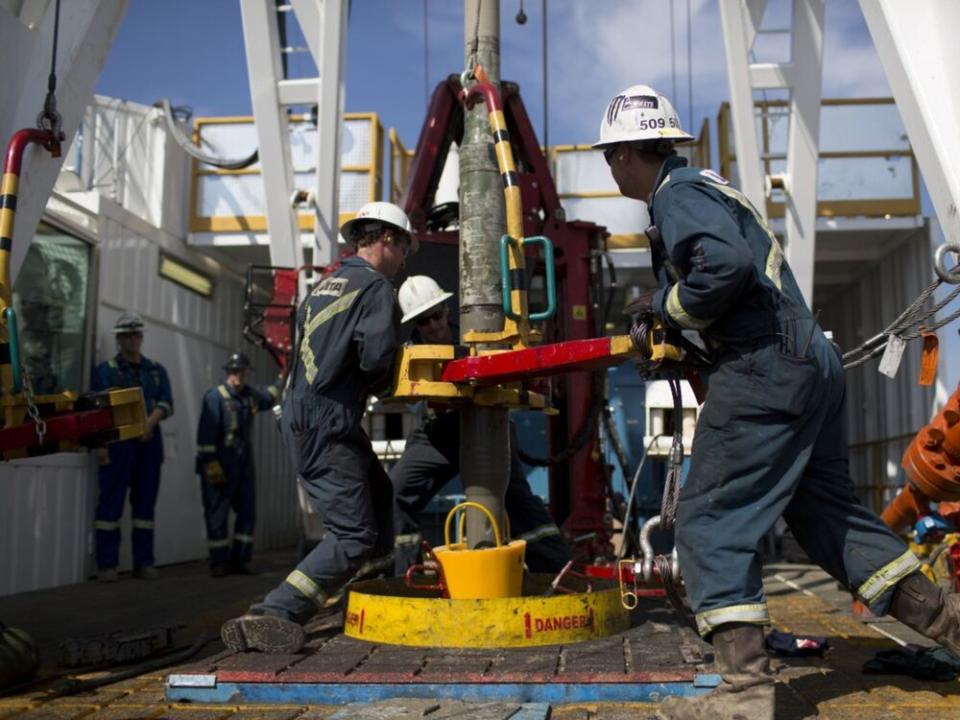  Employees torque a pipe at a wedge well at Christina Lake, a situ oil production facility half owned by Cenovus and ConocoPhillips in Alberta.