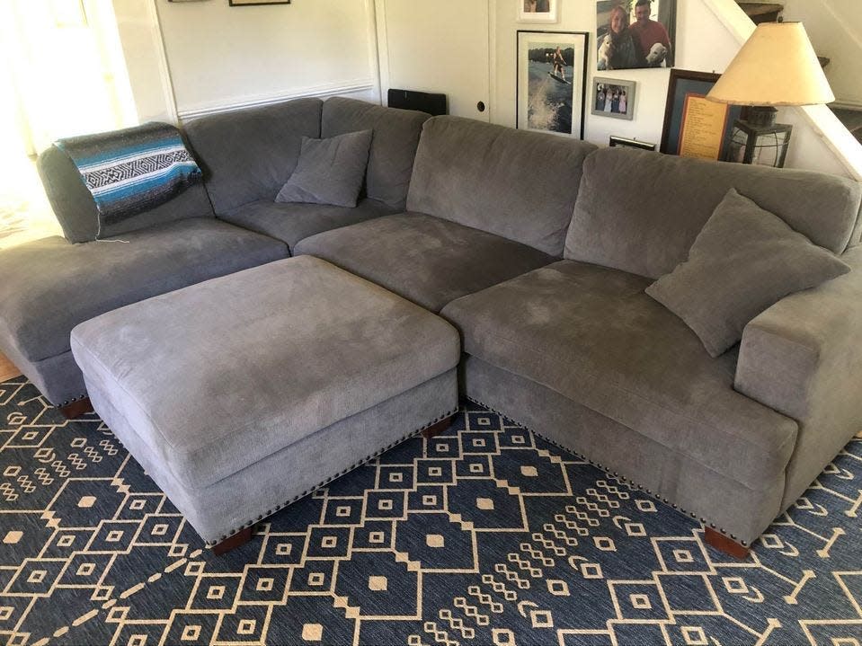 Large gray sectional couch in living room