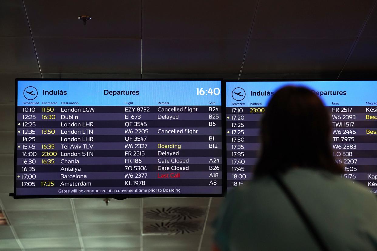A passenger looks at a departure board at Ferenc Liszt International Airport in Budapest, Hungary, as flights to the UK and Ireland have been cancelled as a result of air traffic control issues in the UK. Picture date: Monday August 28, 2023.